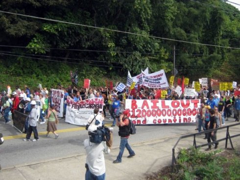 $12 Trillion has been given by the US government to large banks and corporations since last year